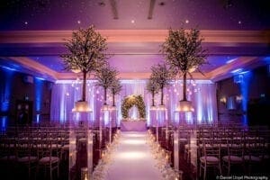 Wedding venue with fake trees down the aisle